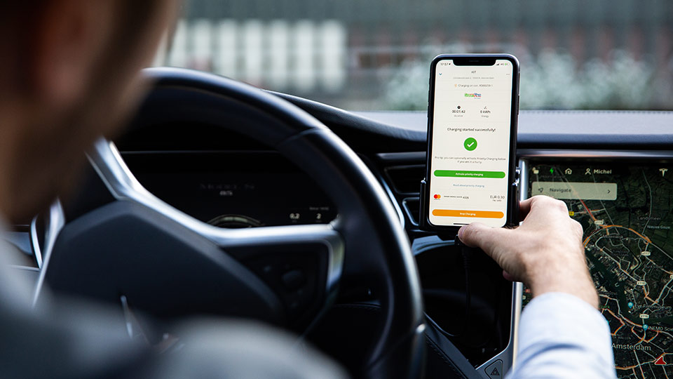 Man the Charge Assist App inside an electric car