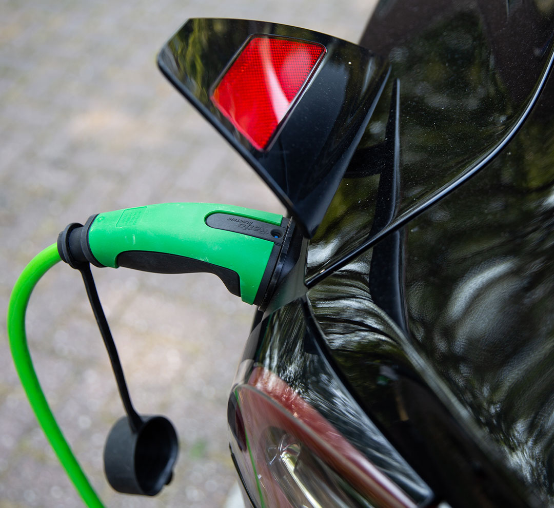 An electric vehicle with a connected charging cable