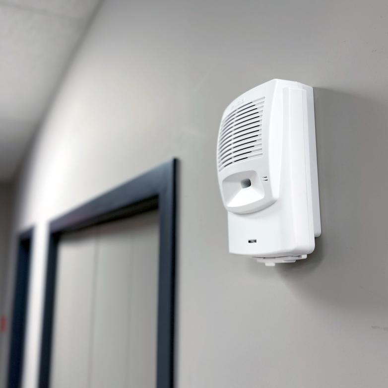 Image of Algo 8180 Audio Alerter mounted on a wall in a hallway for loud ringing.